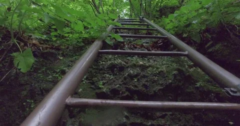 Raising on an iron ladder. Stock Footage 75710799