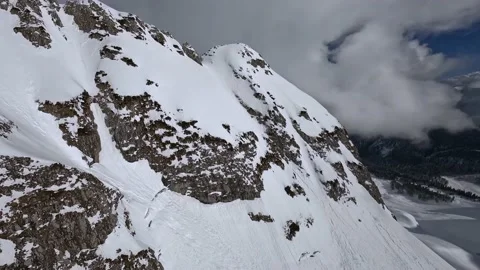 Raising up to mountain peak stone texture summit snow sunny cliff valley wild Stock Footage 232360269
