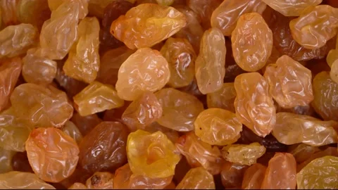 Raisins dried grape macro background, rotates top view Stock Footage 231814409