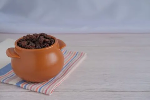 Raisins in a pot. Stock Photos