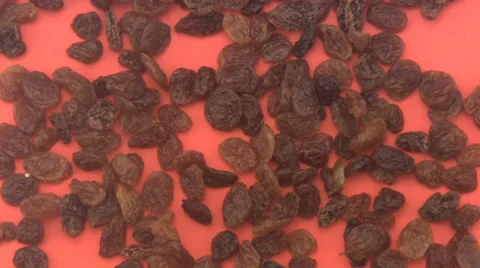Raisins on a red background. Stock-Footage 39563003