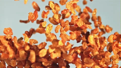 Raisins soar up and fall down. Filmed is slow motion 1000 fps. Stock Footage 202142983
