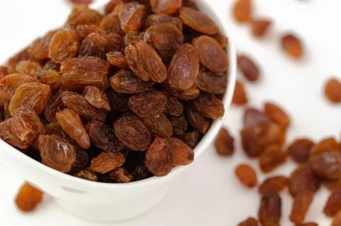 Raisins on white background,top view. Stock Photos