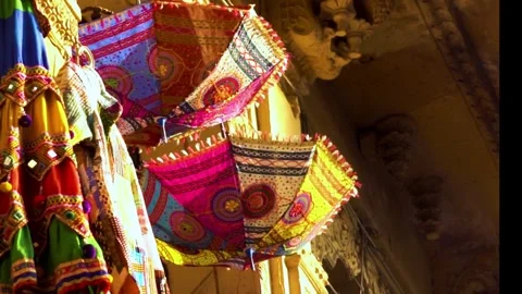 Rajasthani umbrellas and clothes Stock Footage 275594876
