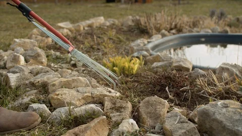 Rake collecting old grass Stock Footage 128790124