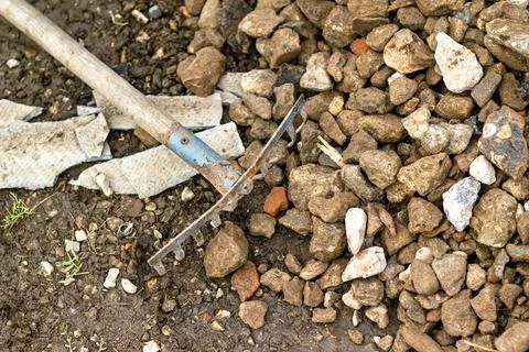 A rake for leveling rubble. Building materials. Stock Photos