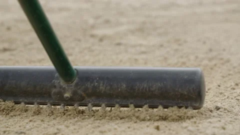 Rake pulled towards camera in sandtrap 스톡 동영상 153696730