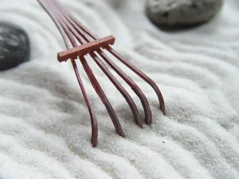 Rake in zen garden Stock Photos