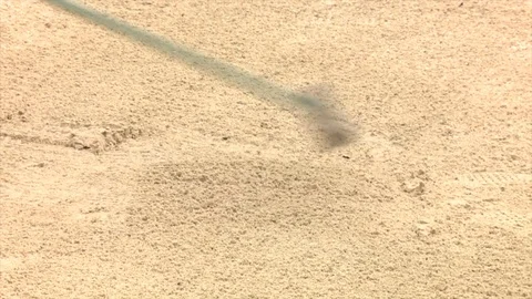 Raking a bunker on a golf course Stock Footage 80509264
