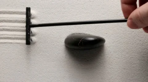 Raking in Zen garden Video stock 12750434