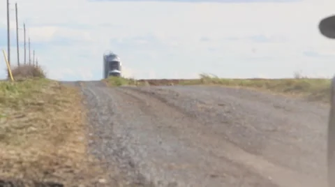 Rally car speeds off down dirt road Stock Footage 56861419