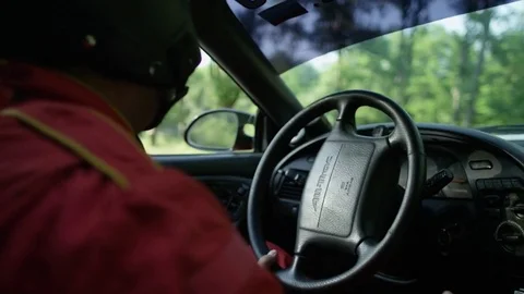 Rally driver drifting around a high speed dirt race track Stock Footage 75464823