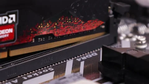 RAM installs in the socket on motherboard. PC hardware update or assembling Stock Footage 195156936