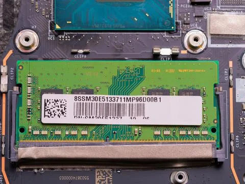 RAM module inserted into laptop motherboard slot 库存照片