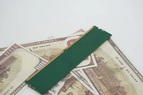 RAM (Random Access Memory) with a dollar bill in the background. Stock Photos
