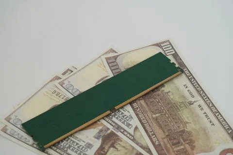 RAM (Random Access Memory) with a dollar bill in the background. Stock Photos