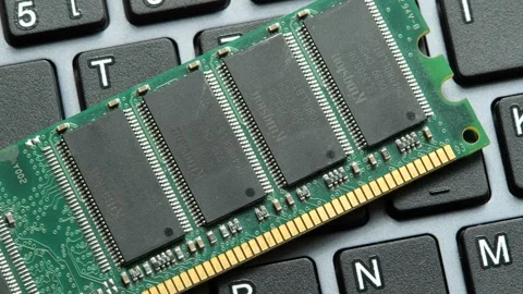 RAM stick laying on a computer keyboard, desktop PC memory upgrade parts co.. Stock Footage 237281021