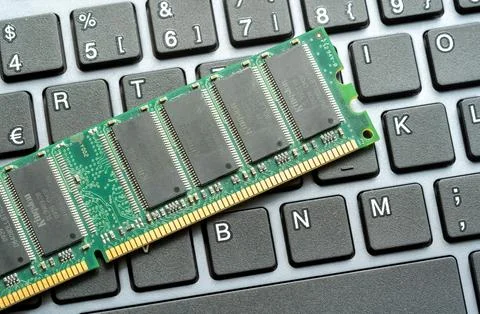 RAM stick laying on a computer keyboard, desktop PC memory upgrade parts co.. Stock Photos