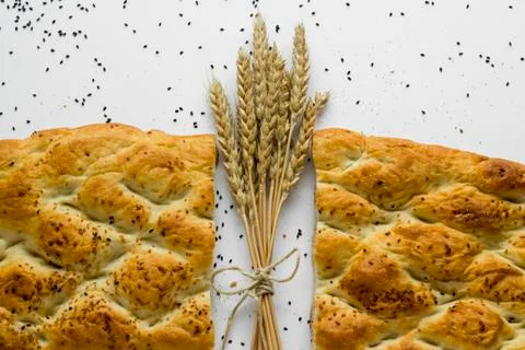 Ramadan Bread,Pide cut in half and a bunch of wheat ears between them Stock Photos