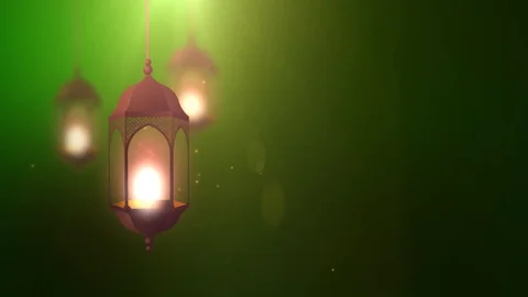 Ramadan candle lantern falling down hanging on string green background Stock Footage 96233652