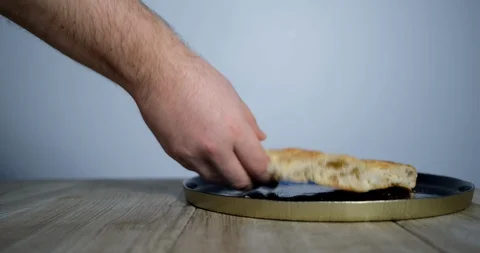 Ramadan concept about solidarity, close-up of the the man puts 4 pieces of pi Stock Footage 129584396