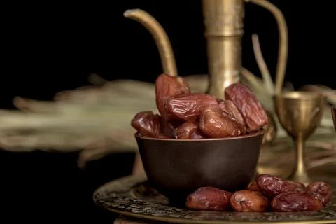 Ramadan concept. Dates closeup in the foreground. Ramadan Lantern on a wooden Stock Photos