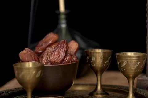 Ramadan concept. Dates closeup in the foreground. Ramadan Lantern on a wooden Stock Photos