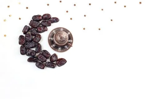 Ramadan, iftar desktop composition. Dried date fruit arranged in moon shape Stock-Fotos