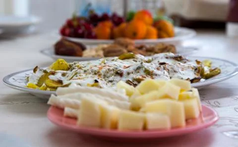 Ramadan iftar table along with cheese, zucchini, appetizers and fruits. Stock Photos