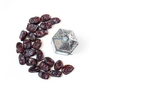 Ramadan, iftar table composition. Dried date fruit arranged in moon and silver Stock Photos