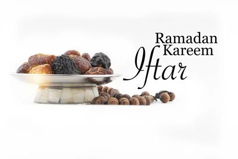 RAMADAN KAREEM IFTAR text with Dates or kurma fruits and rosary beads or Tasb 写真素材
