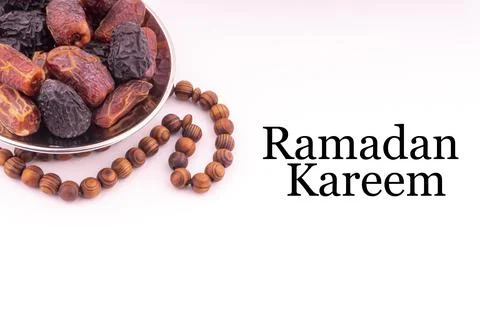 RAMADAN KAREEM text with Dates or kurma fruits and rosary beads or Tasbih on  写真素材