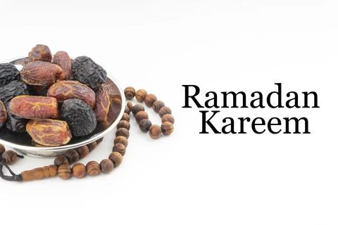 RAMADAN KAREEM text with Dates or kurma fruits and rosary beads or Tasbih on  写真素材