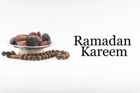 RAMADAN KAREEM text with Dates or kurma fruits and rosary beads or Tasbih on  写真素材