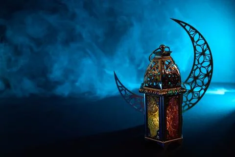 Ramadan lantern bringing light to night with moon Stock Photos