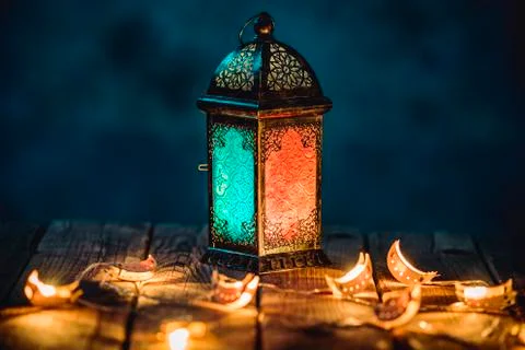 Ramadan Lantern with Colorful Light Glowing at Night and Glittering with Boke 库存照片