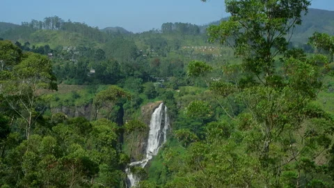 Ramboda Falls cascading down lush green hills in Sri Lanka Stock Footage 311424709