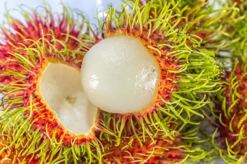 Rambutan fruit with red shell on white background Foto stock