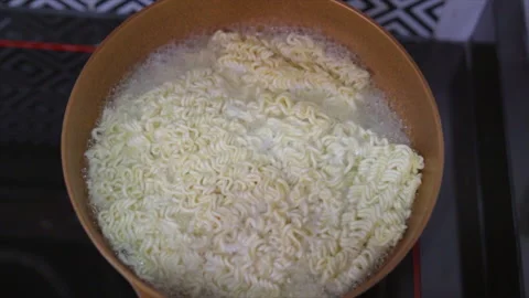 Ramen instant noodles in boiling in the ... | Stock Video | Pond5