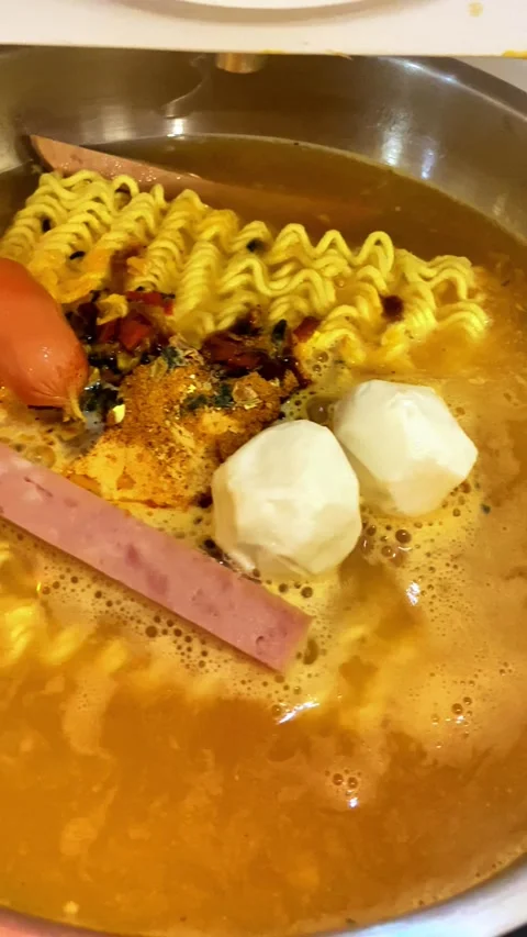 Ramen prepared in a noodle maker, instant noodles with various additional Video stock 296689807