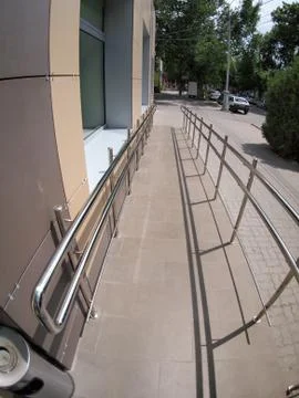 Ramp for physically challenged from the tiled pavement Stock Photos