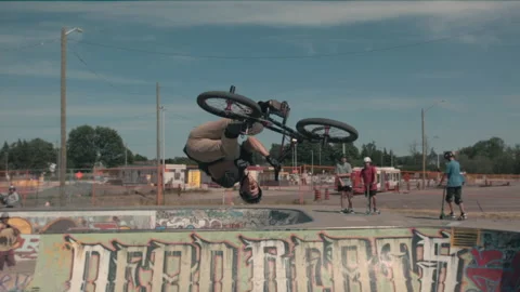 Ramped slow motion backflip bar spin skateboard park Video stock 171256197