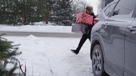 Ramped slow motion slip and fall with christmas gifts Stock Footage