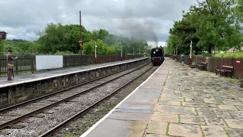 RAMSBOTTOM UK 2024 May 27; 1940s Steam train event. 4k Video Stock Footage 276368768