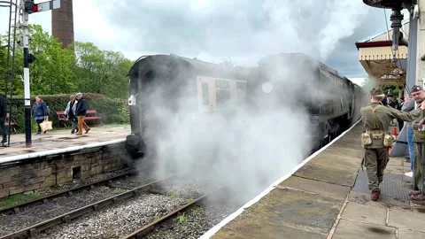 Ramsbottom UK 27 May 2024; 1940s Steam train celebration event. 4k video Stock Footage 276369027