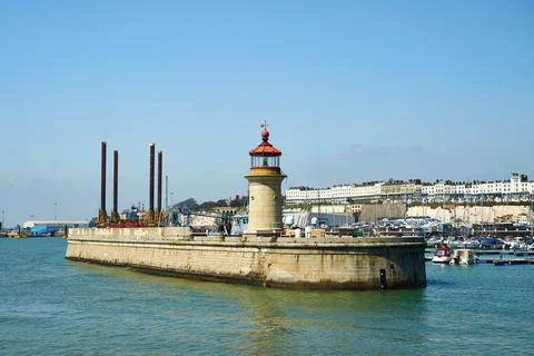 Ramsgate Lighthouse viewed from the East Pier with the port in the background Stock Photos