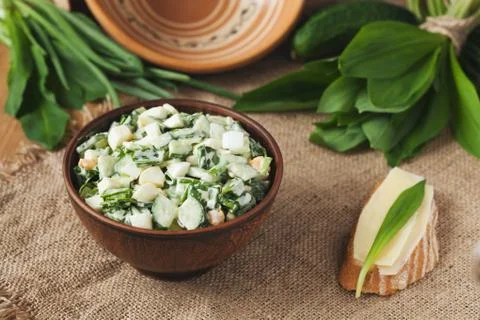 Ramson salad in rustic style with eggs and sandwich Stock Photos