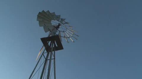 Ranch windmill against clear blue sky Stock Footage 8960663