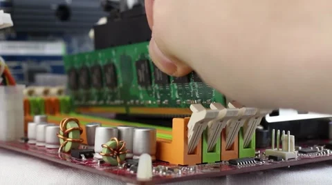 Random access memory installing on a motherboard Stock Footage 59784625