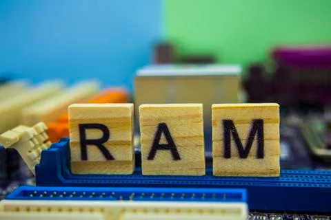 Random Access Memory or RAM word on wooden cubes with technology background 写真素材